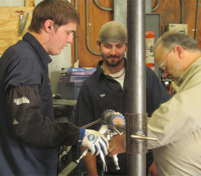 Brice and Tad Honing Pipe-Fitting Skills.